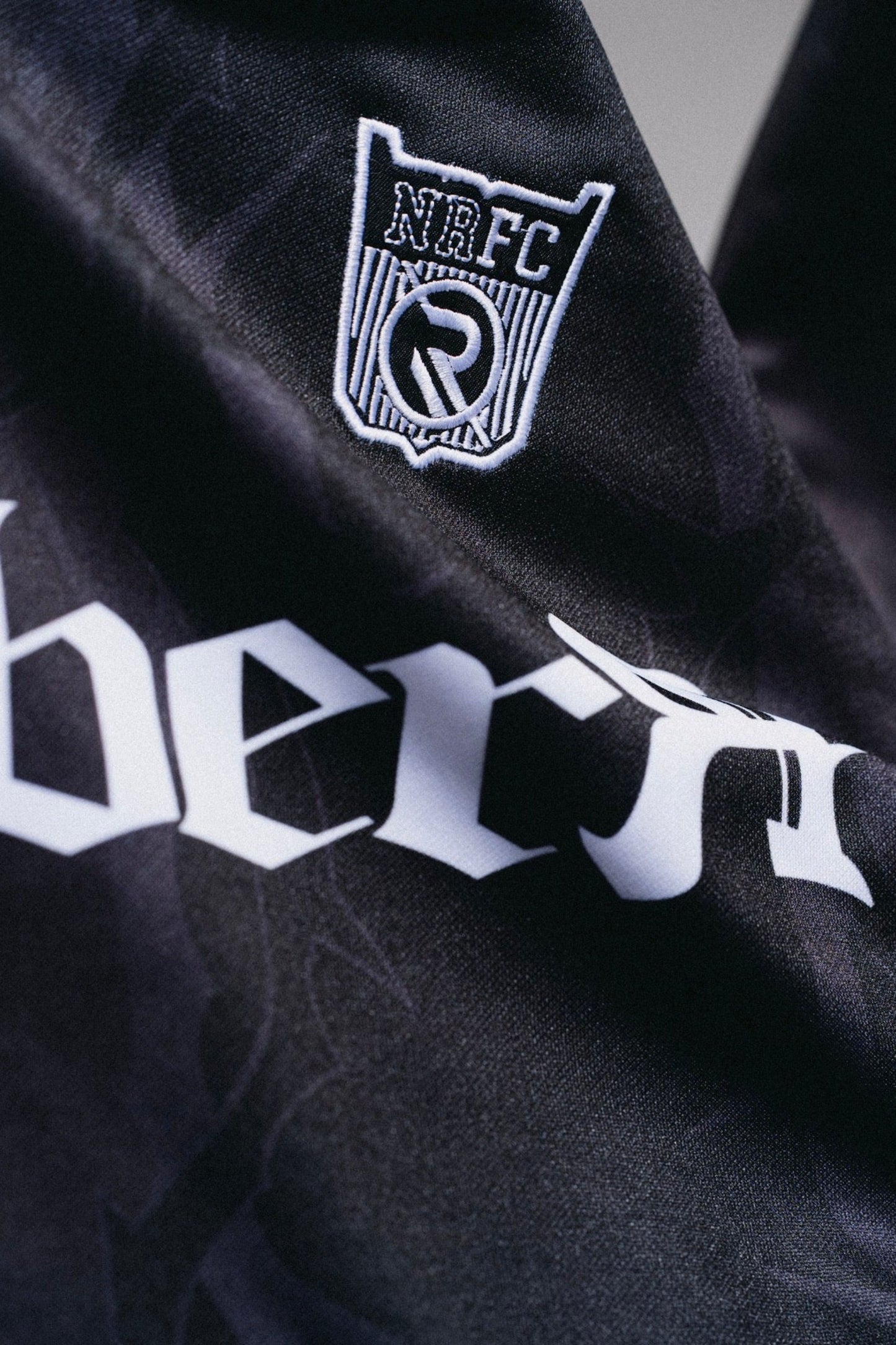 NR BLACK RUGBY SHIRT
